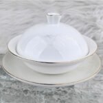 Understated Mountain Opulence Four‑Leaf Lucky Cup with saucer.